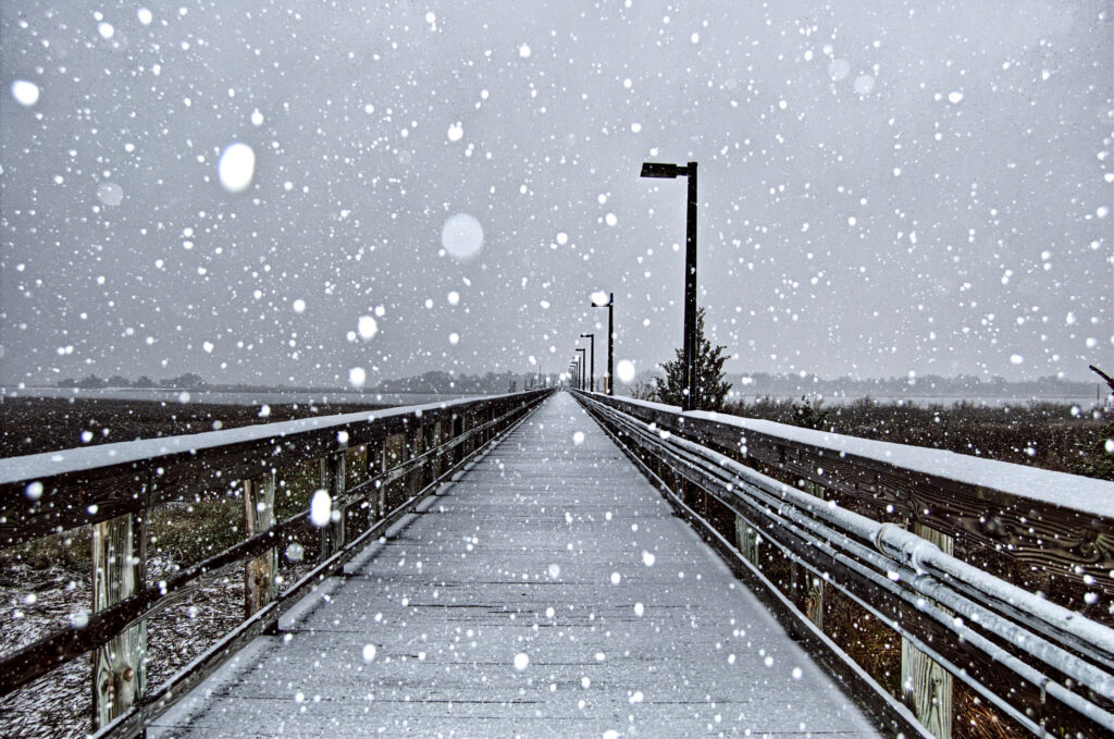 A photo of snow falling on a dock in Wilmington in January 2009