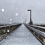 A photo of snow falling on a dock in Wilmington in January 2009