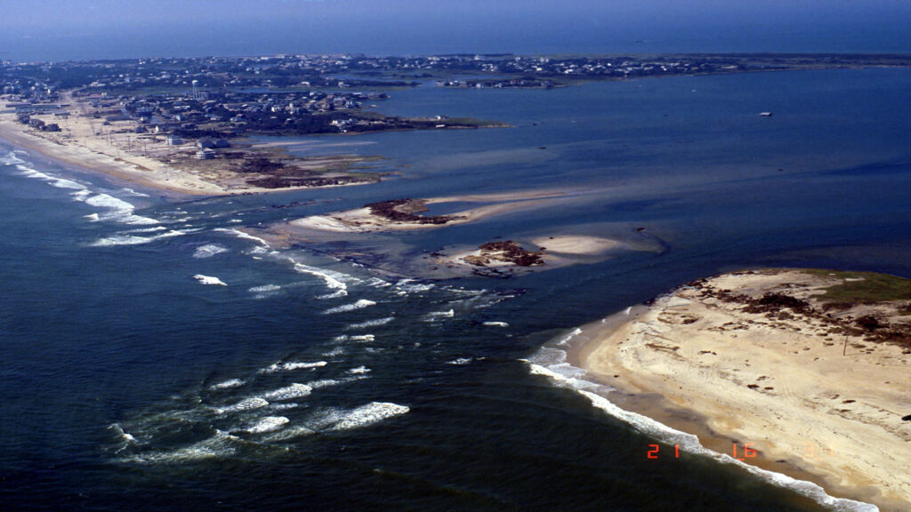 An aerial view of an inlet cut into Hatteras Island by Hurricane Isabel in September 2003